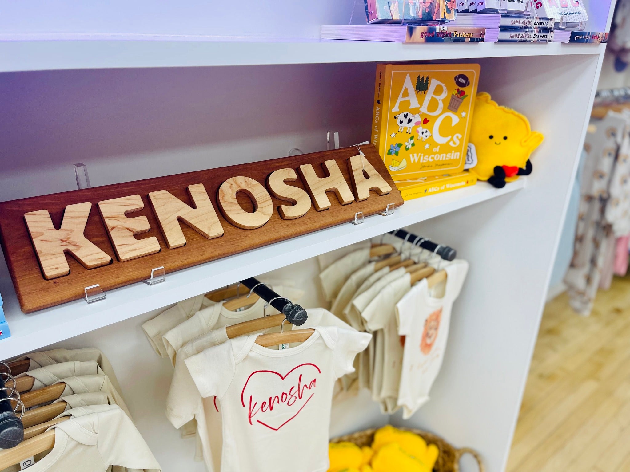 Kenosha themed onesies and wooden puzzle