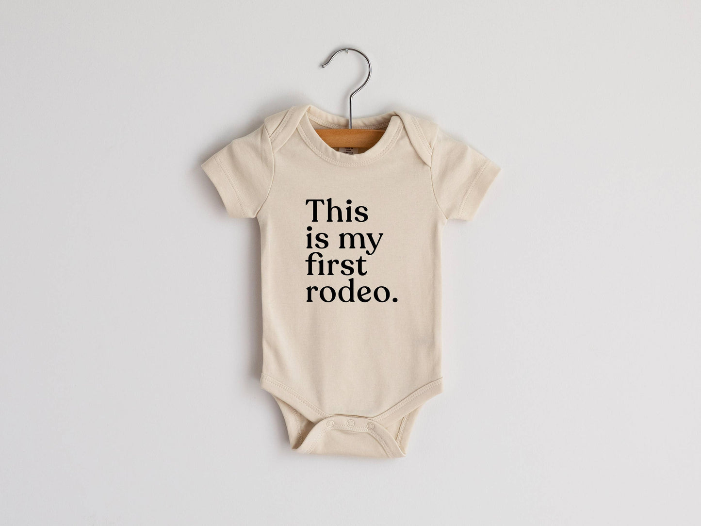 Gladfolk - Cream This Is My First Rodeo Modern Organic Baby Bodysuit: Short Sleeve