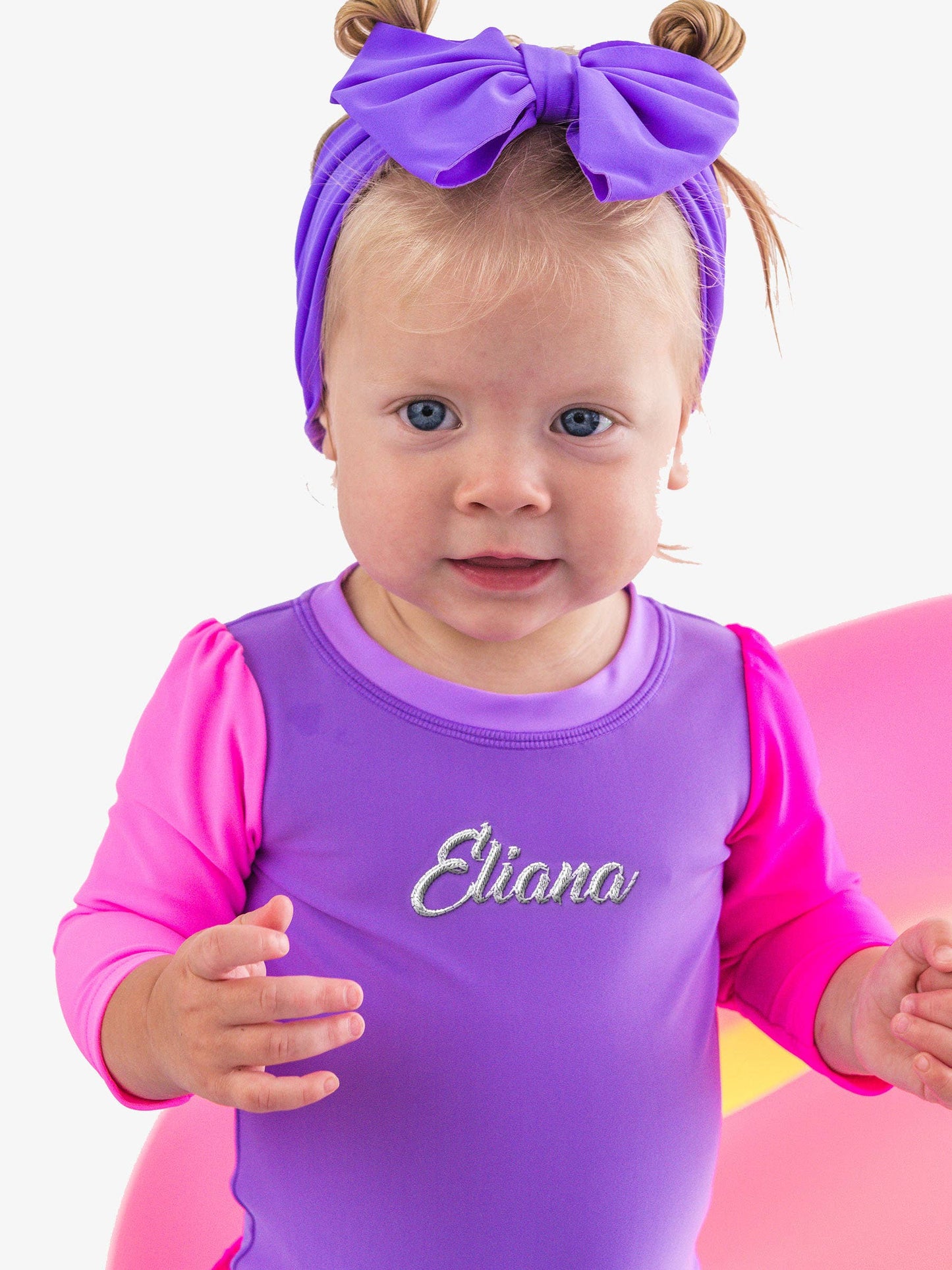 RuffleButts + RuggedButts - Baby Girls Neon Purple Color Block Long Sleeve One Piece Rash Guard Swimsuit with Signature Rear Ruffles: Purple