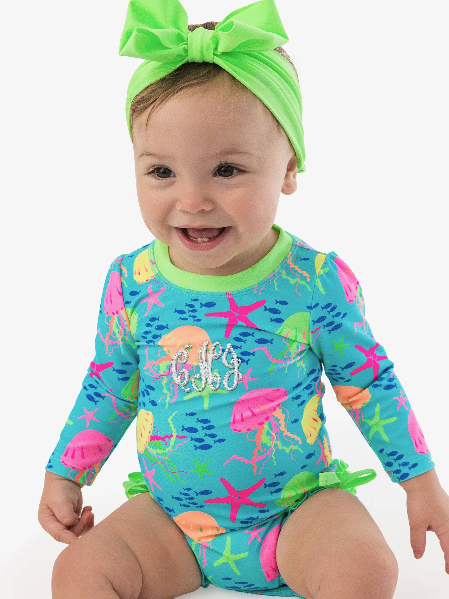 RuffleButts + RuggedButts - Baby Girls Neon Jelly Time Long Sleeve One Piece Rash Guard Swimsuit with Signature Rear Ruffles: Blue