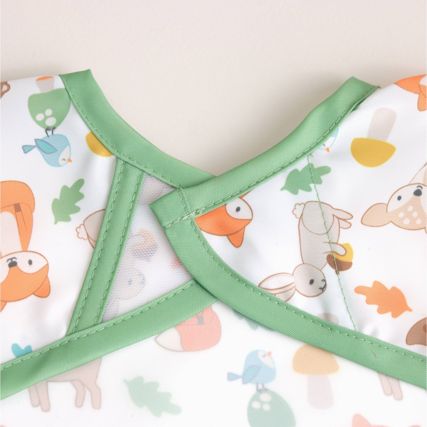 Itzy Ritzy - Itzy Everywhere Bib™ - Long Sleeve Water-resistant Bib: Woodland