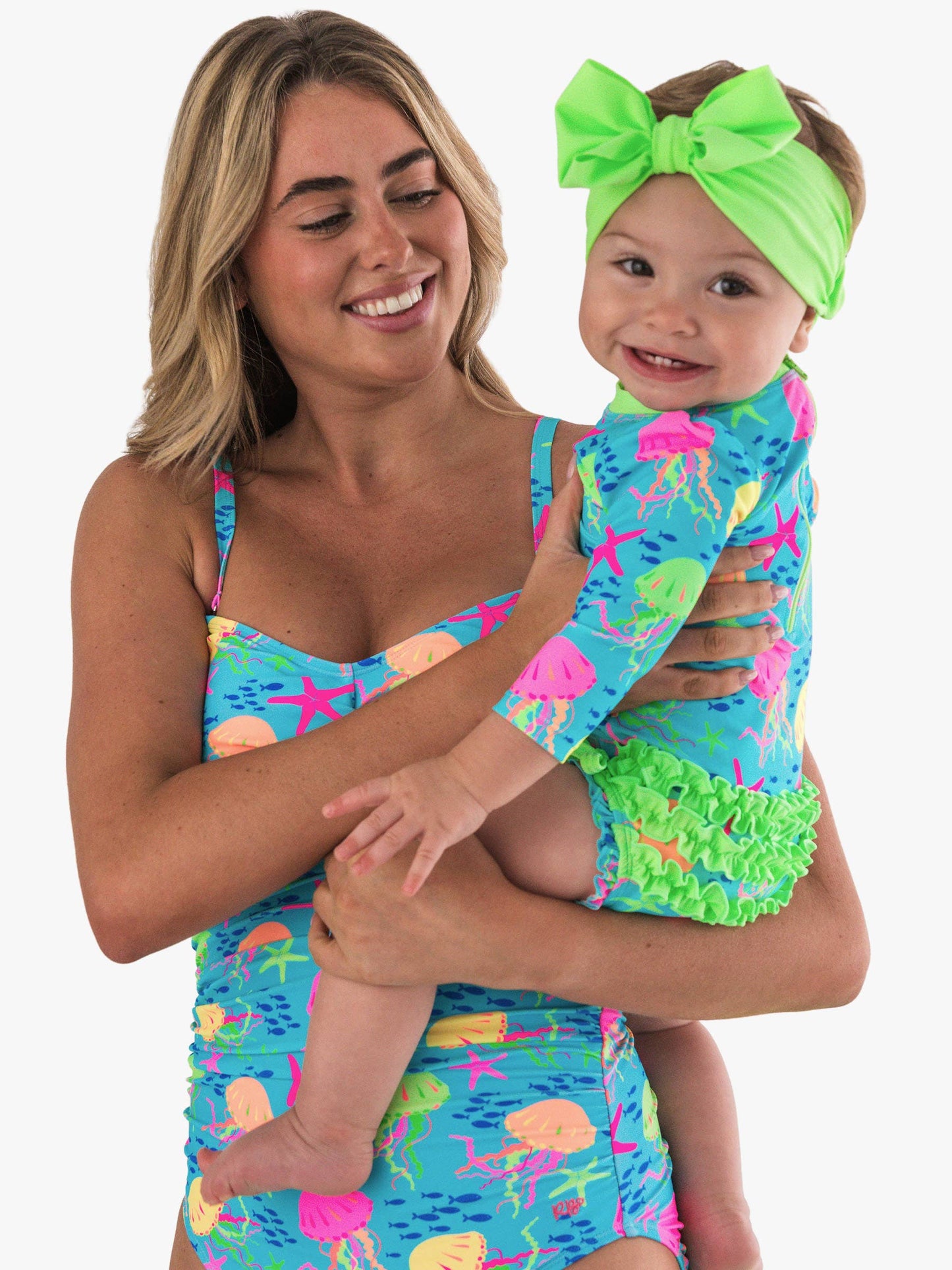 RuffleButts + RuggedButts - Baby Girls Neon Jelly Time Long Sleeve One Piece Rash Guard Swimsuit with Signature Rear Ruffles: Blue