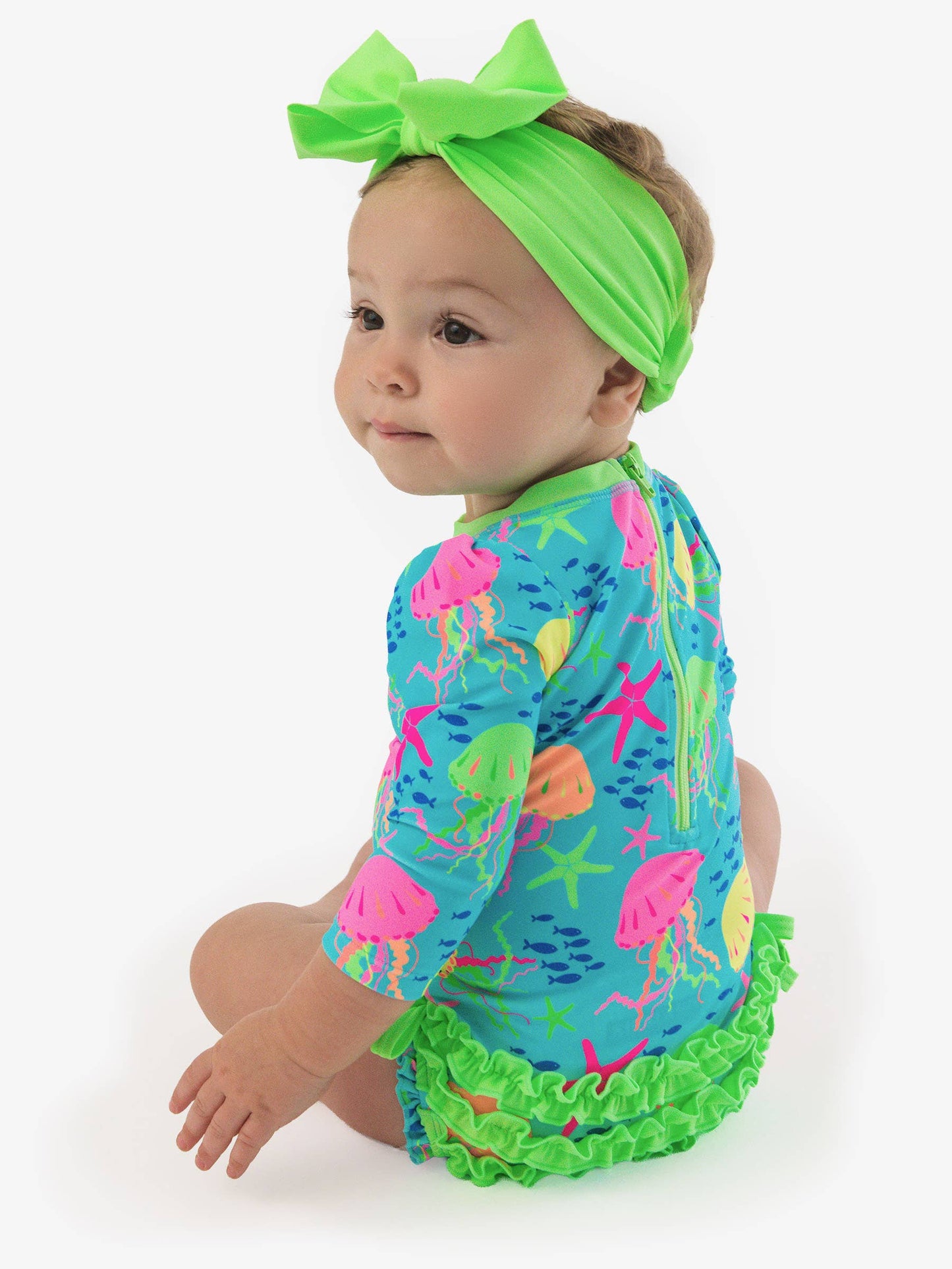 RuffleButts + RuggedButts - Baby Girls Neon Jelly Time Long Sleeve One Piece Rash Guard Swimsuit with Signature Rear Ruffles: Blue